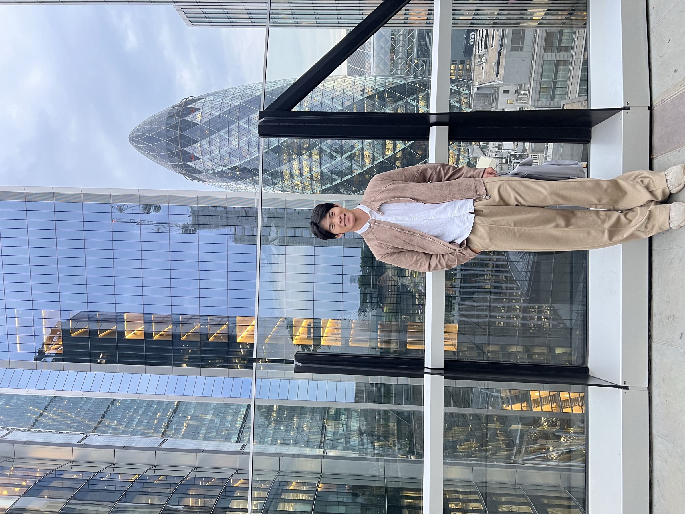 Drew Yang on a London terrace, with the Gherkin behind him
